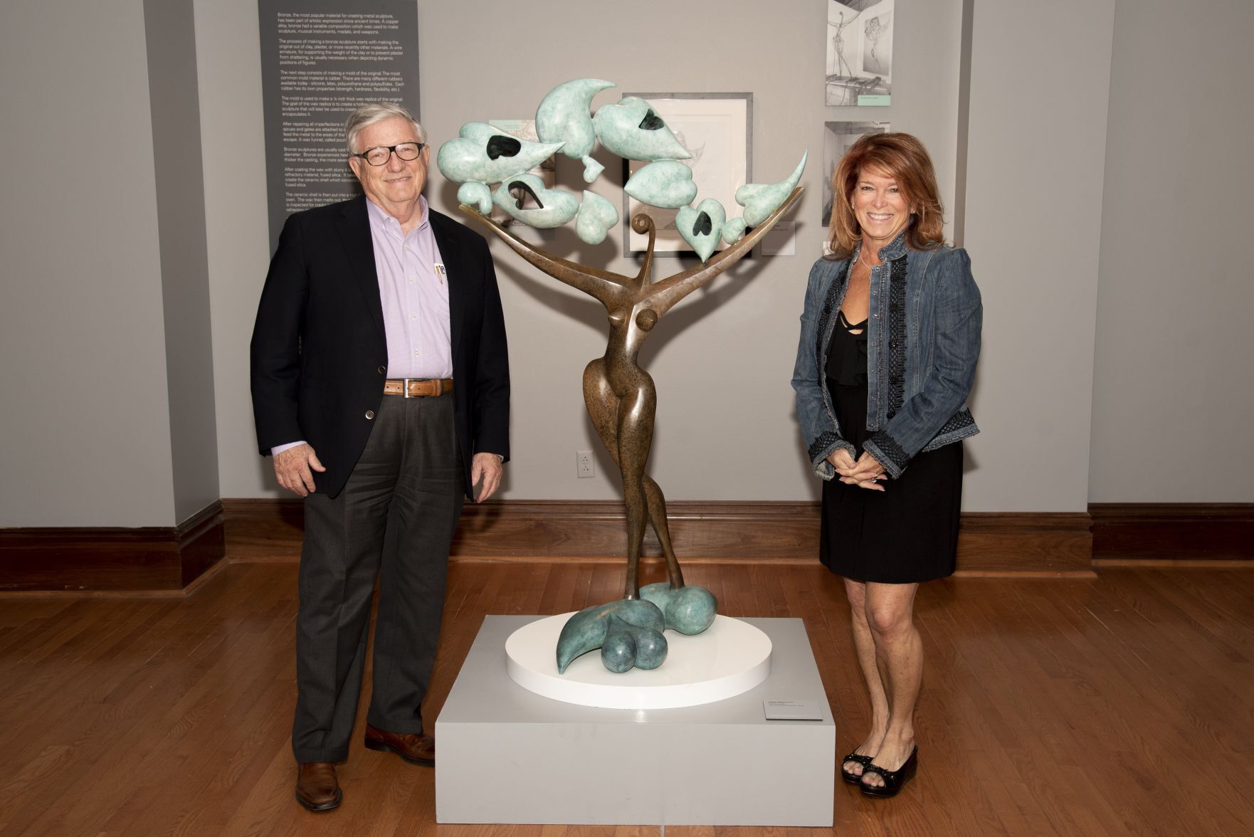 Richard and Kathie Winter beside Leon Bronstein's sculpture "All You Need is Love"